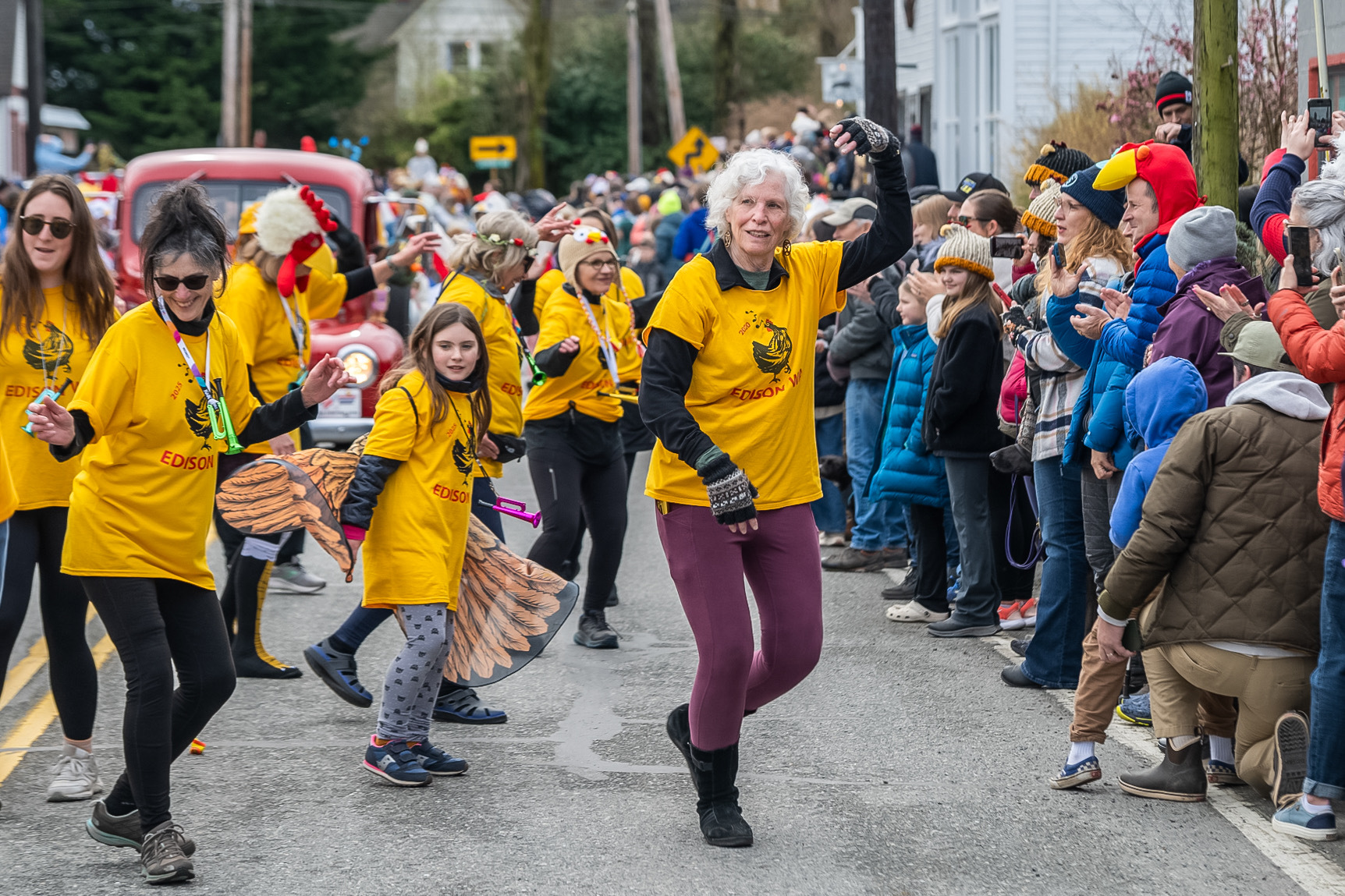 Charlene Day of Samish Island leads a lively group of dancers in the annual Edison Chicken Parade on Feb. 24. The quirky community tradition draws large crowds, celebrating all things chicken.
