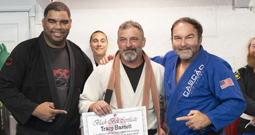 Brazilian jiu-jitsu champion awards La Conner coach with black belt